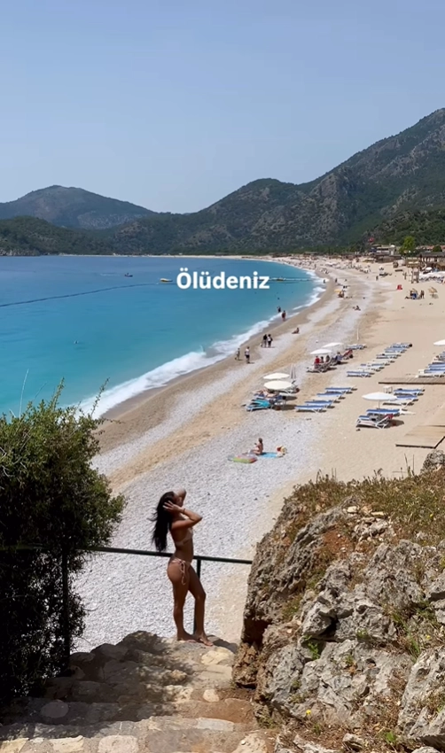 The breathtaking and iconic view of the Blue Lagoon and its long sandy beach from the cliffs above in Ölüdeniz, Turkey.