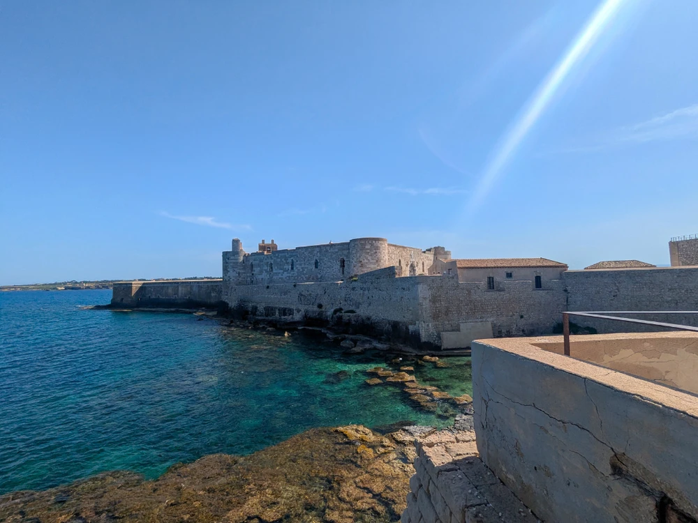 View of Castello Maniace fortress at the southern tip of Ortigia overlooking the Ionian Sea