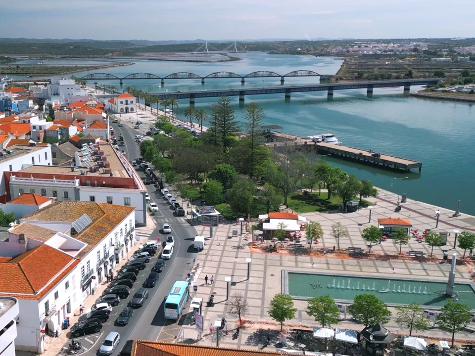 Aerial view of Praça Manuel Teixeira Gomes along the Arade River in Portimão with fountains and marina backdrop