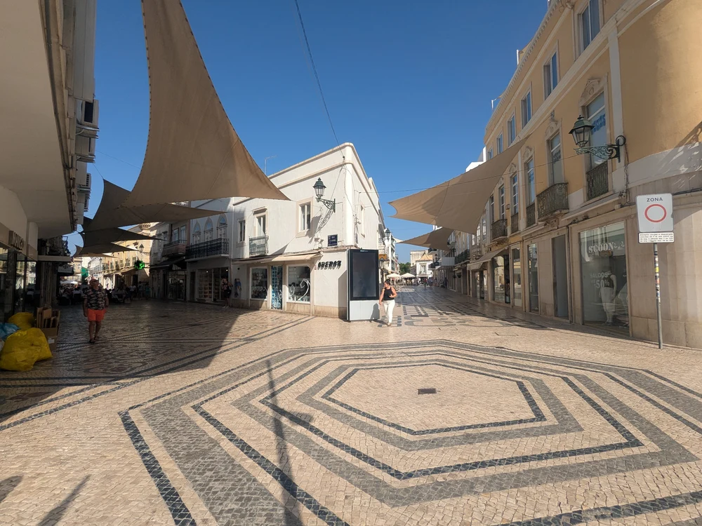 The beautiful mosaic cobblestones of Rua de Santo António, a popular pedestrian shopping street in the heart of Faro.