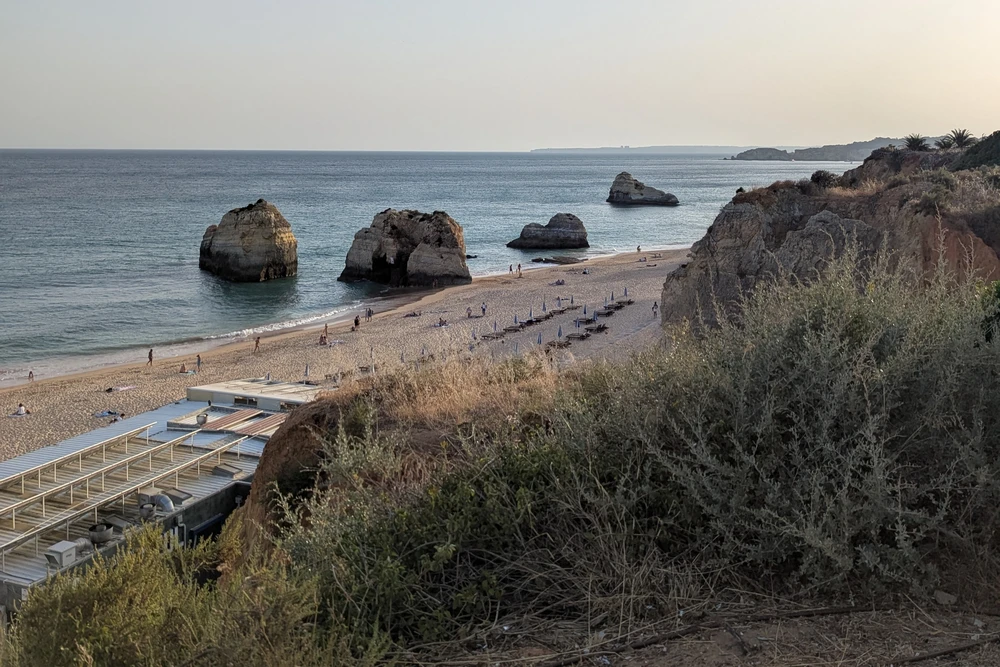 Panoramic view of Praia dos Três Castelos in Praia da Rocha with iconic sea stacks and golden sand